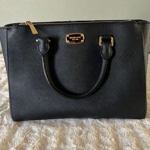 Black Michael Kors purse with gold detailing